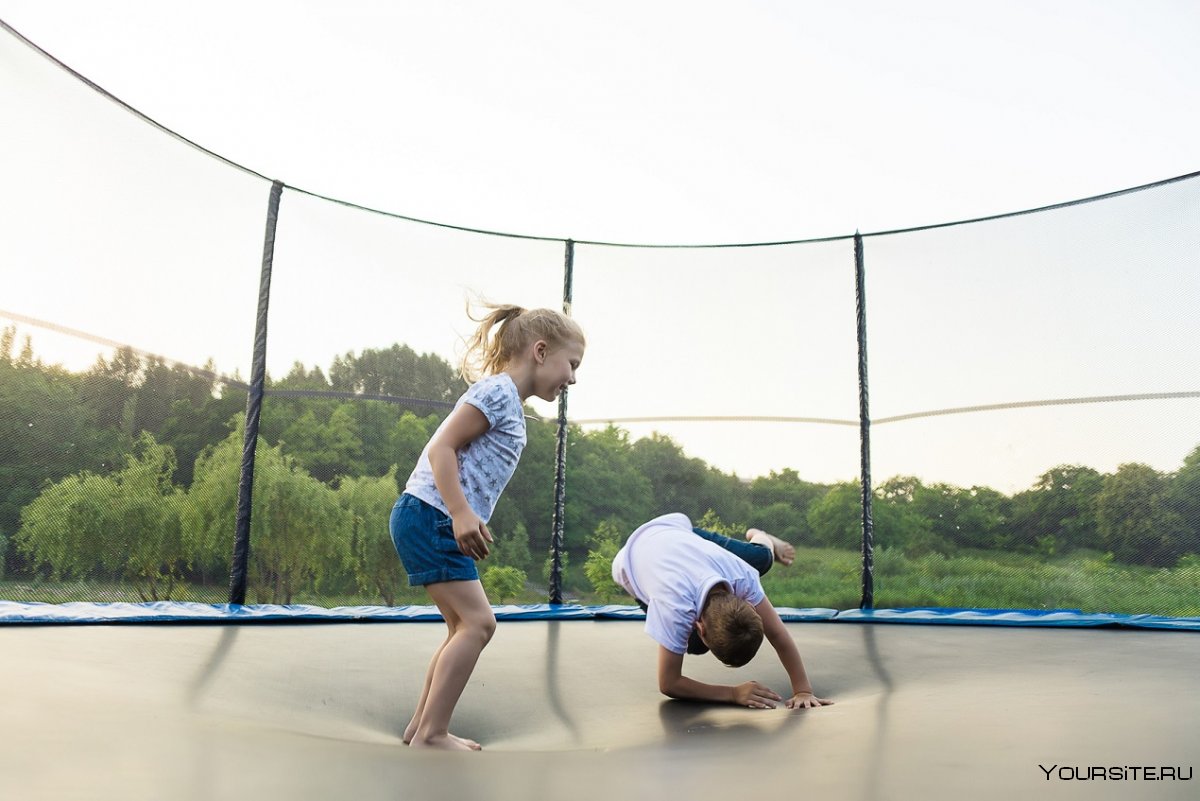 Children jumping on a Trampoline in a children's Park