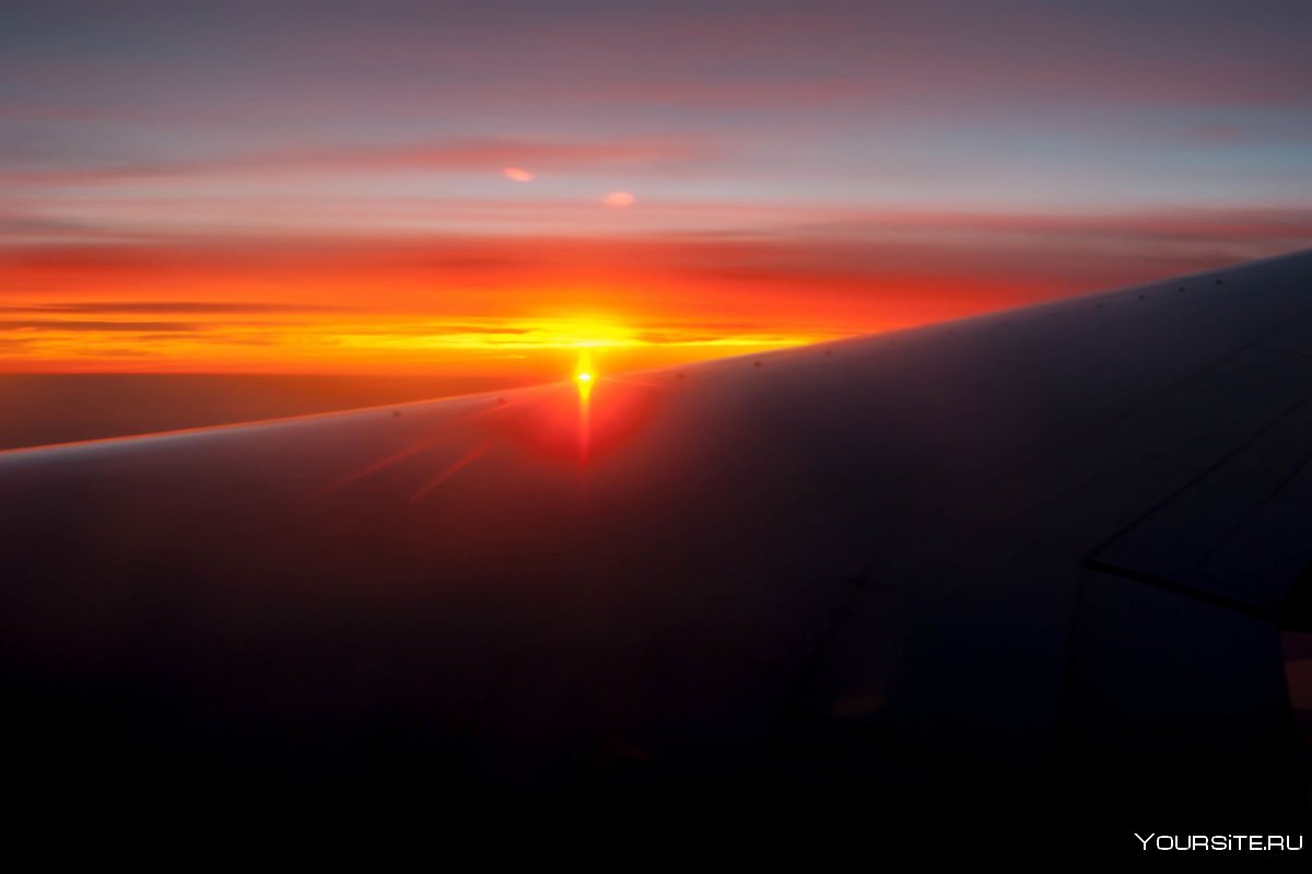 Рассвет из самолета фото