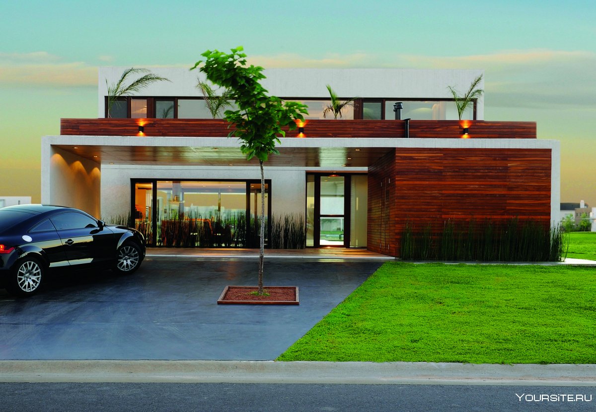 Дом в современном стиле с панорамными окнами и гаражом